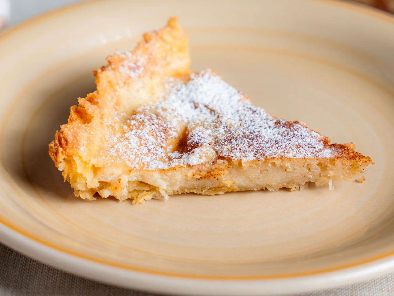Slice of powdered dessert cake on a plate