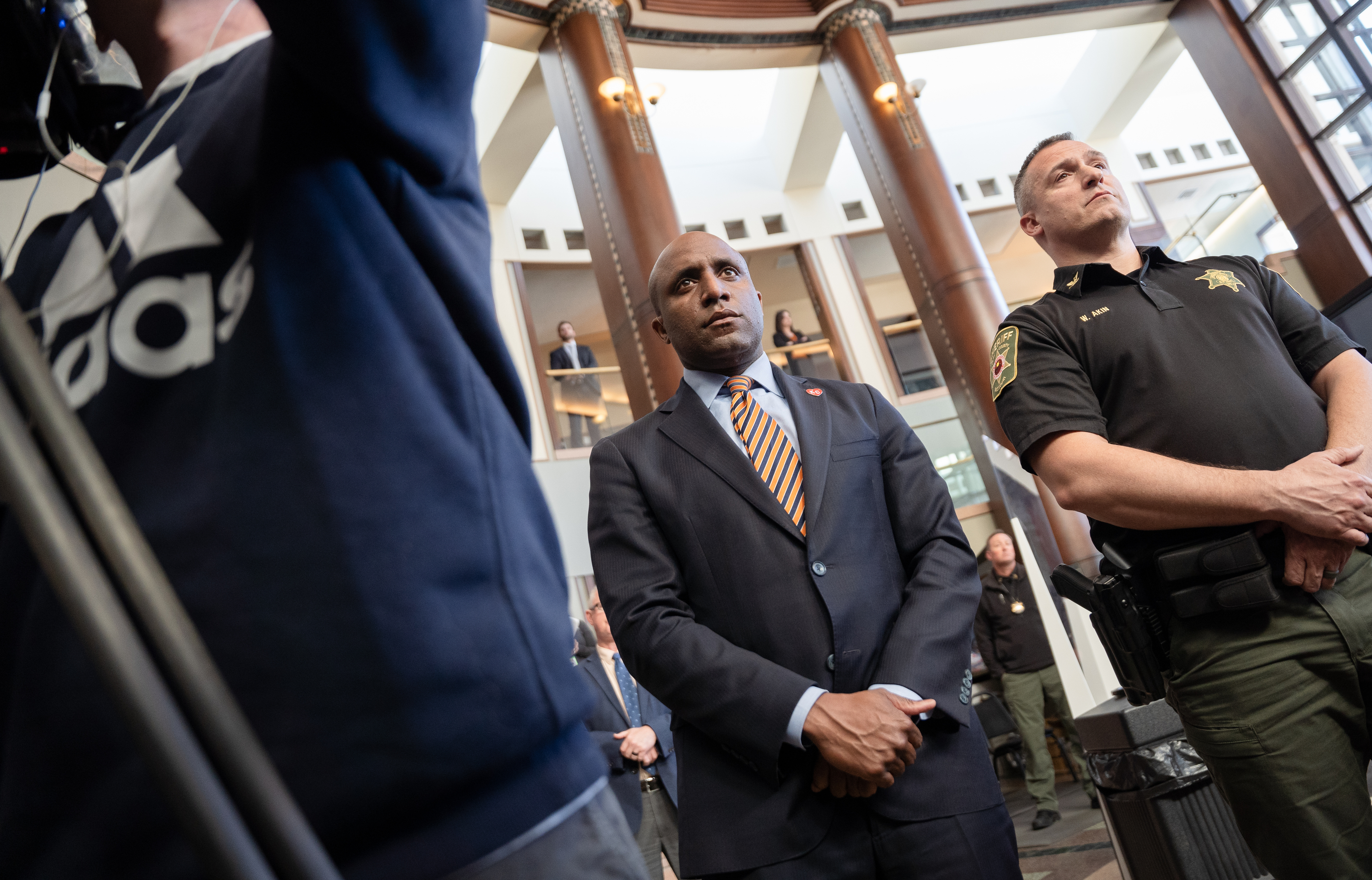 Kansas City Mayor Quinton Lucas, center, said of using warehouses to hold detainees, “I’m not sure that this is the type of detention that is humane.”