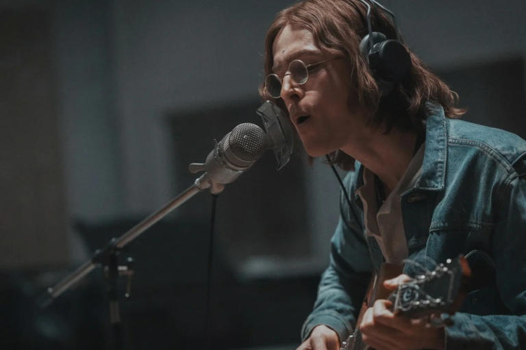 Harris Dickinson is John Lennon in Columbia Pictures' "The Beatles — A Four-Film Cinematic Event. (Photo by: Chiabella James)
