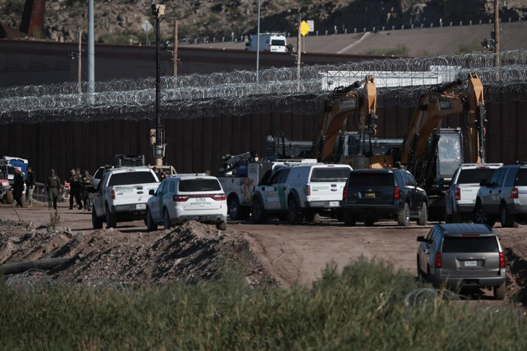 Migrants disguised as construction workers attempt to blend in at ...