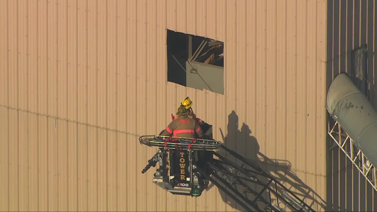 Sky 11 over rescue of person trapped in elevated sand hopper