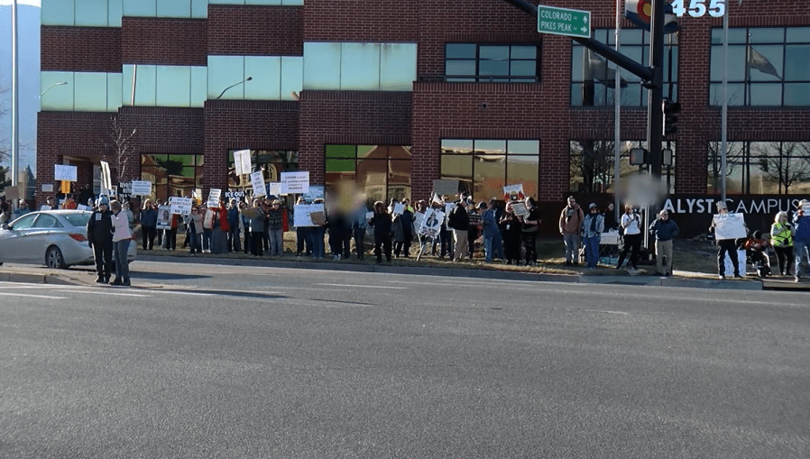 Protesters gather outside Rep. Crank’s office