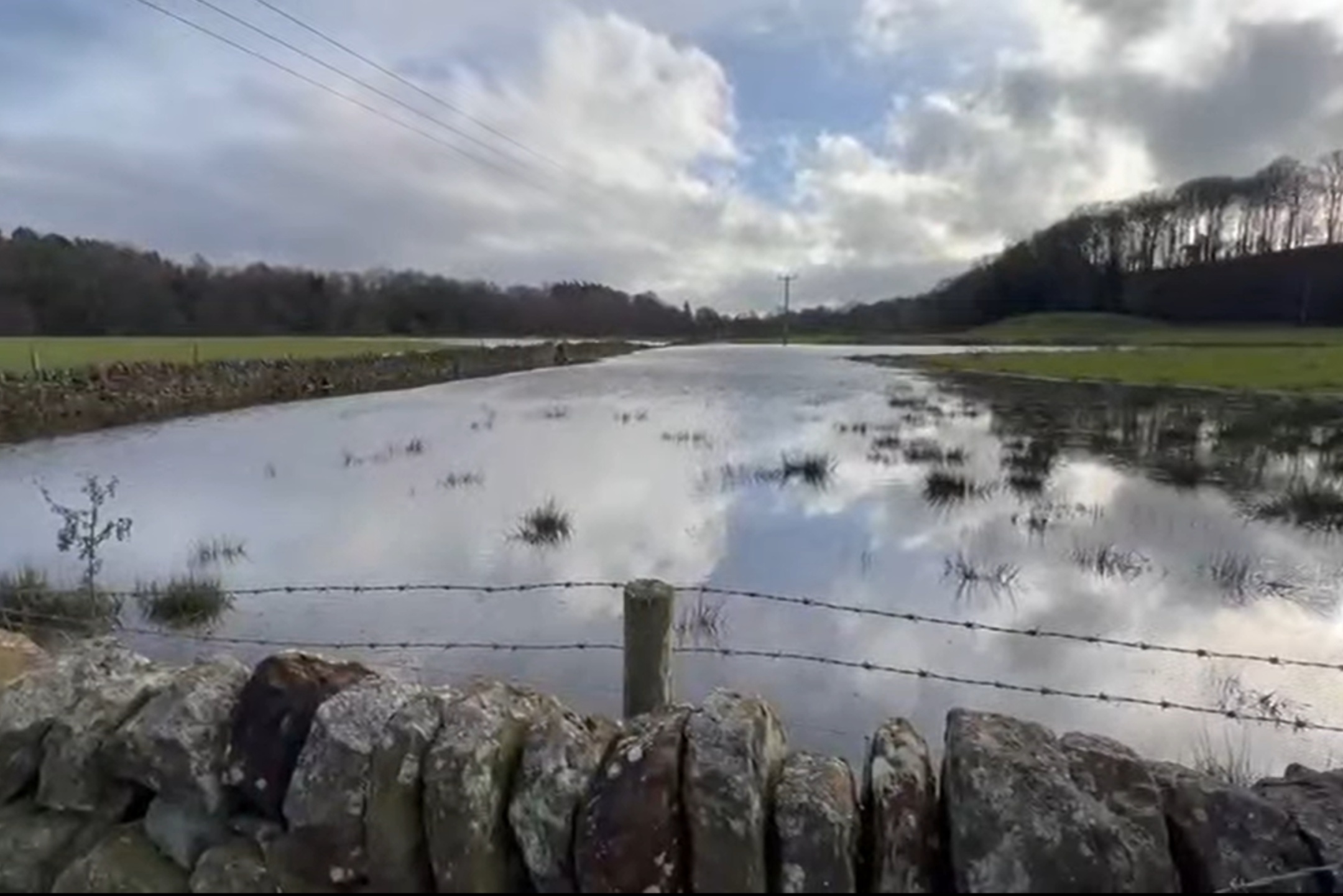 Water company investigates powerful 'spring' linked to flooded fields ...