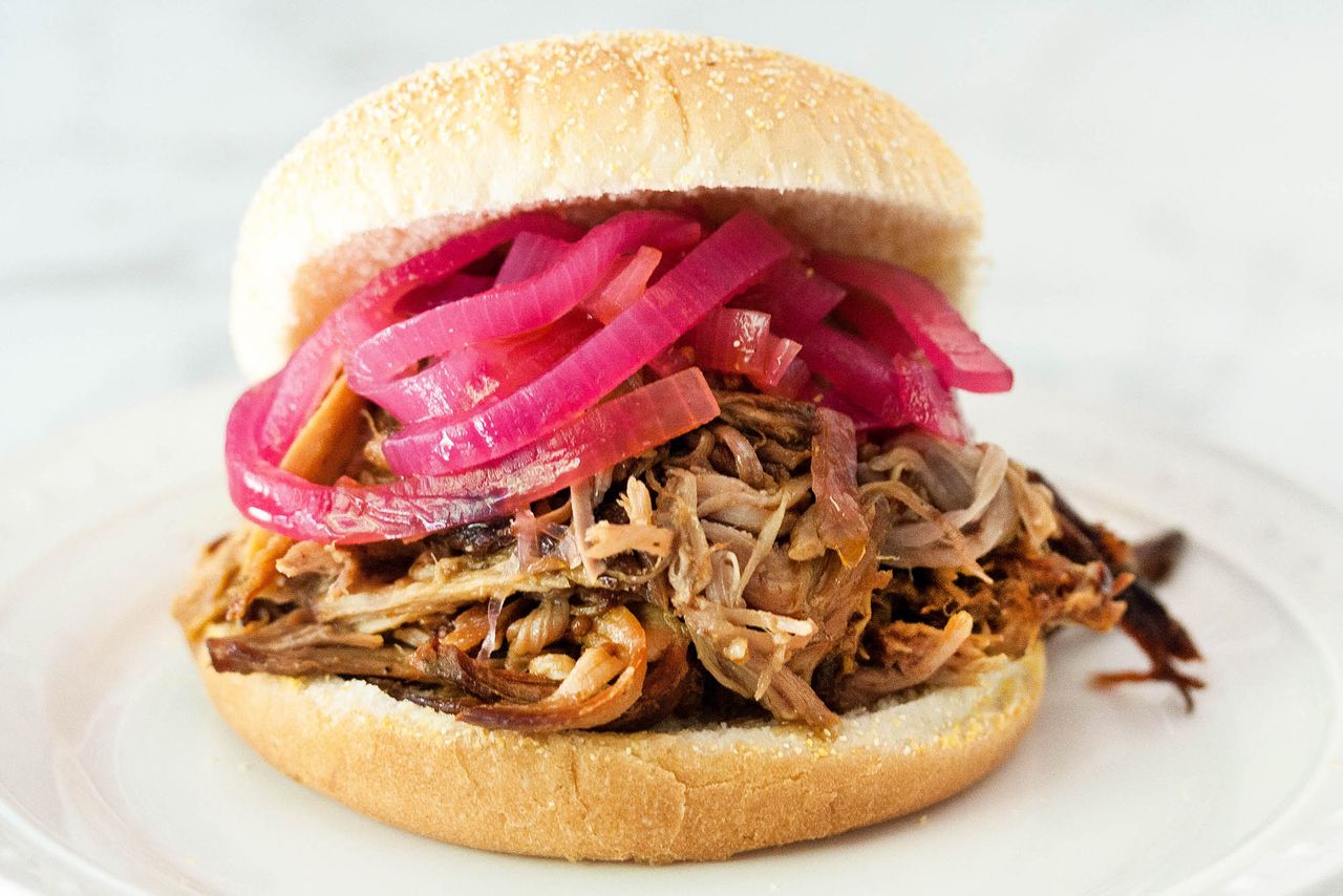 pulled pork sandwich with pickled onions