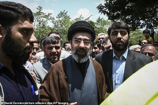 Mojtaba Khamenei (C), son of Iranian Supreme Leader Ayatollah Ali Khamenei, is pictured during a protest on May 31, 2019