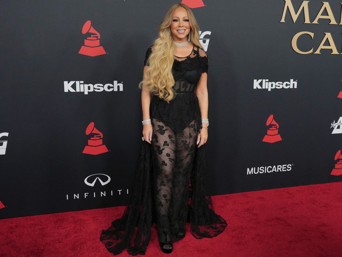 mariah carey sheer dress Mariah Carey showcases her hourglass curves in a gold semi-sheer dress