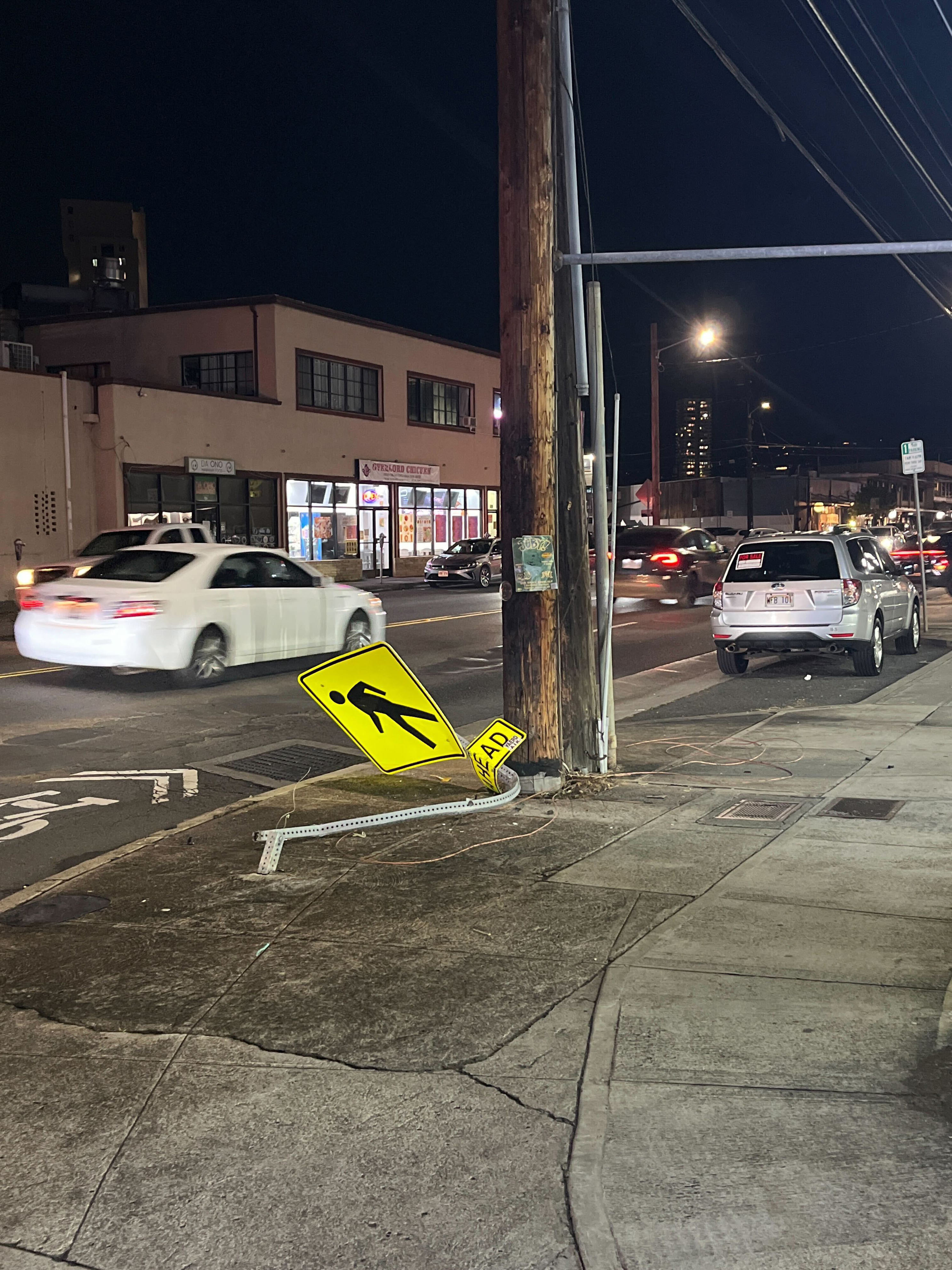 3 injured after vehicle crashes into traffic sign, telephone pole