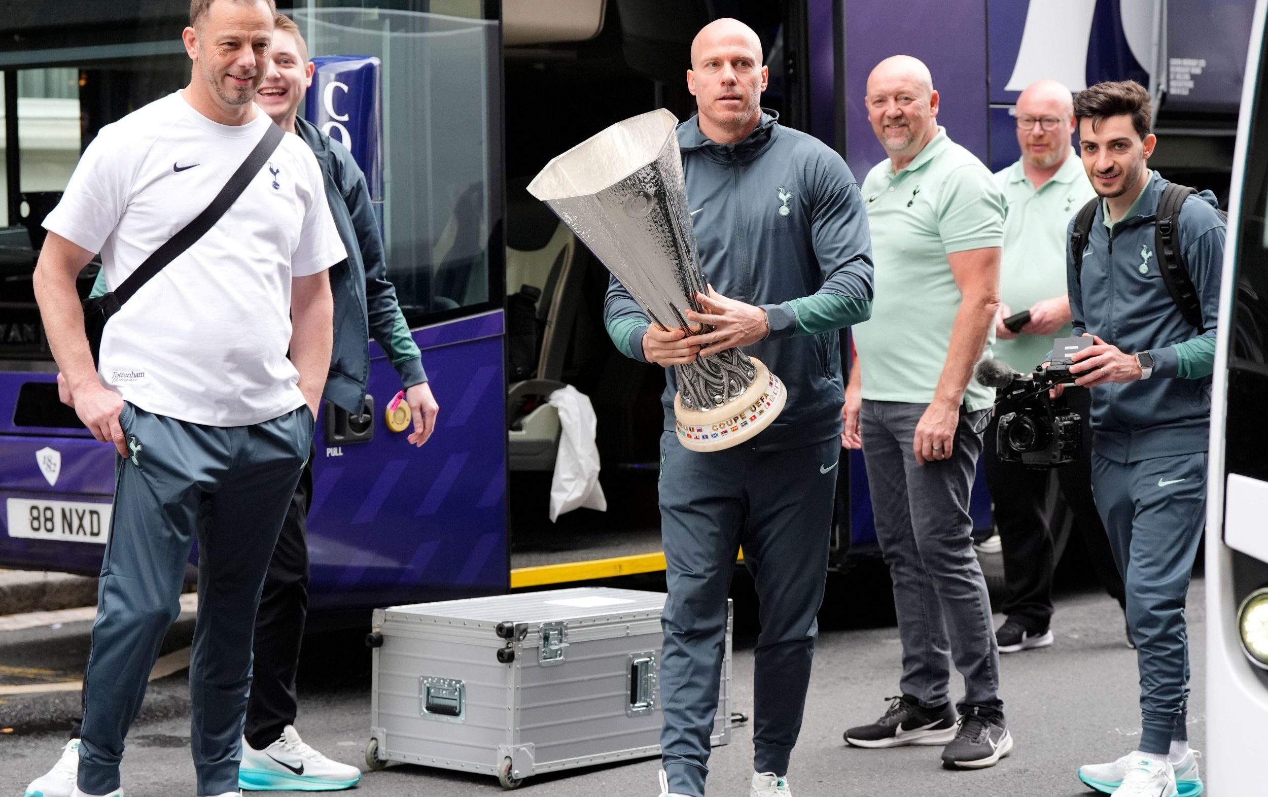 Allan Dixon, Levy’s brother-in-law and still Tottenham’s player liaison officer, carries the Europa League trophy from the team hotel in Bilbao last year - PA Images/Alamy Stock Photo