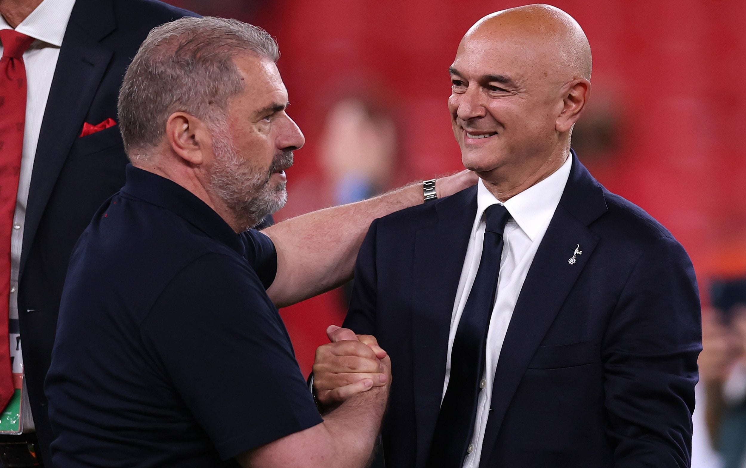 Levy congratulates Ange Postecoglou for winning the Europa League last season, the club’s first trophy for 17 years and days before the head coach was sacked - Getty Images/Ryan Pierse