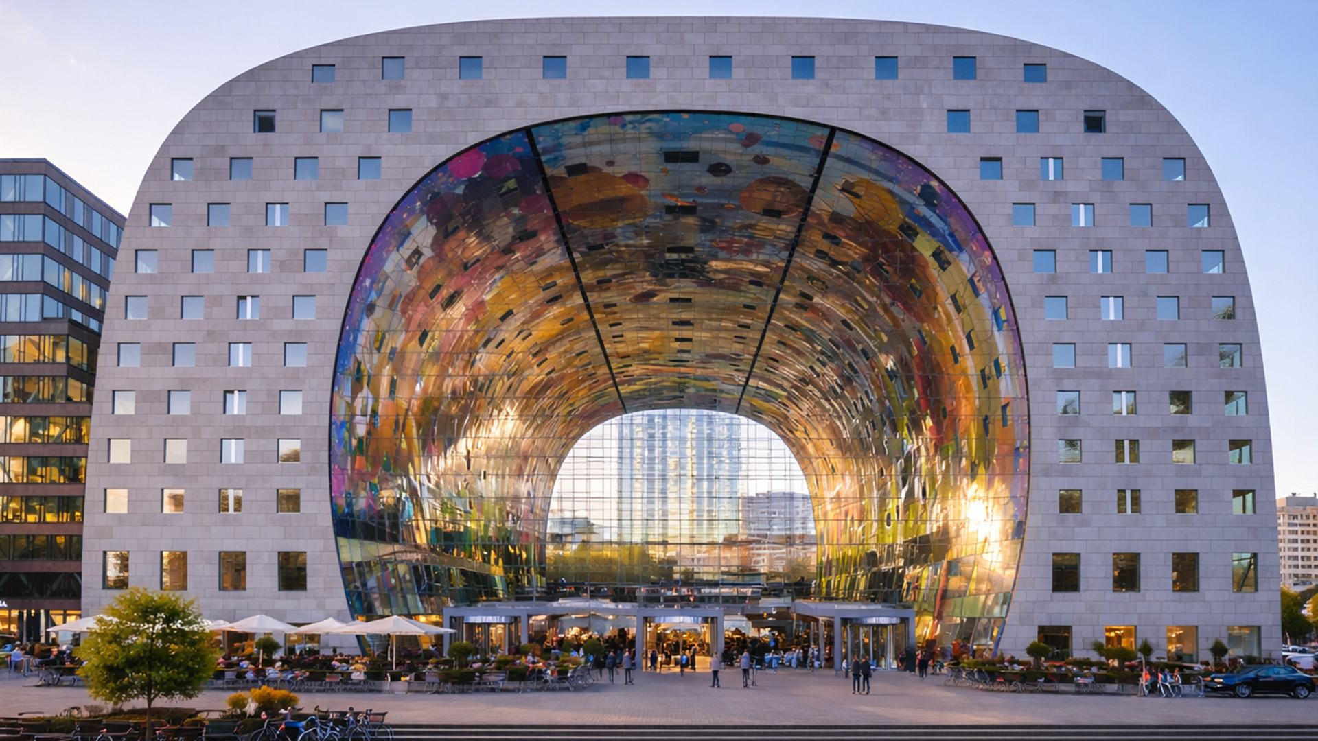 A colorful market inside a giant arch