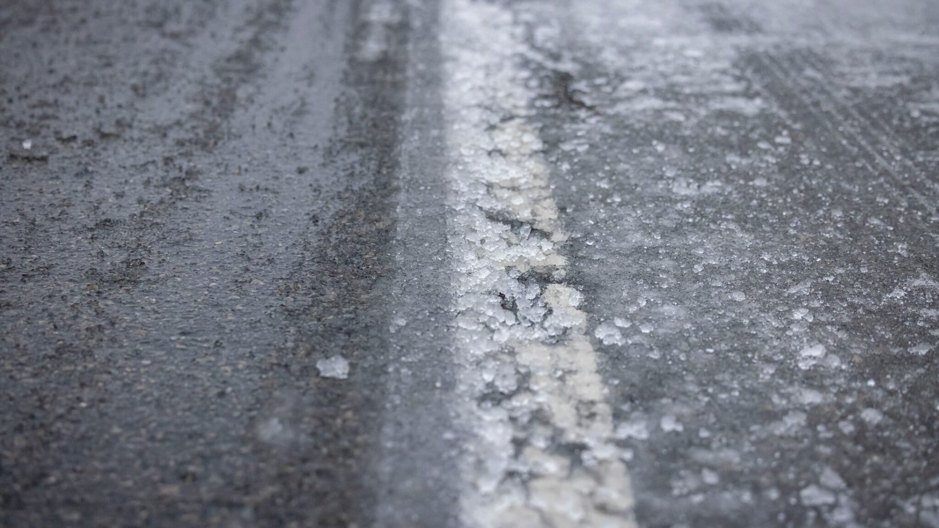 Cold conditions lead to water main breaks, creating dangerous road ...
