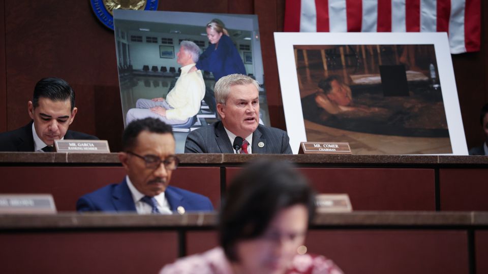 With photographs of former U.S. President Bill Clinton behind him, House Oversight and Government Reform Committee Chairman Rep. James Comer (top right) (R-KY) speaks during a hearing at the U.S. Capitol January 21, 2026 in Washington, DC. - Win McNamee/Getty Images