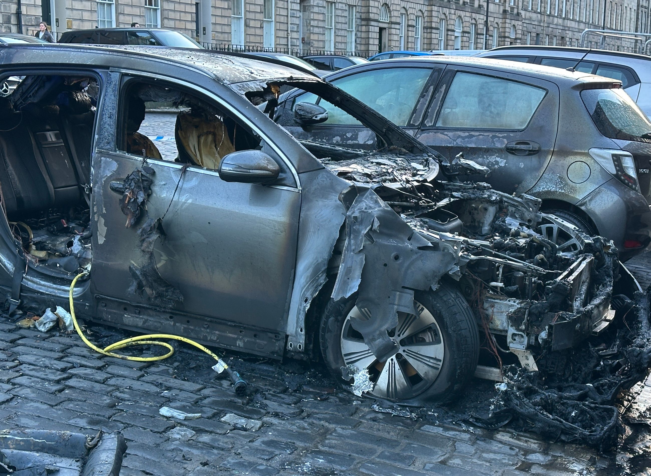 Fire crews rush to Edinburgh city centre after electric car bursts into ...