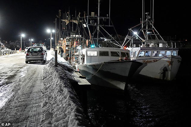 The six unrecovered crew members are all presumed dead due to the frigid temperatures at sea and in the water. Fishing boats tied up at the Lily Jean's home port are pictured