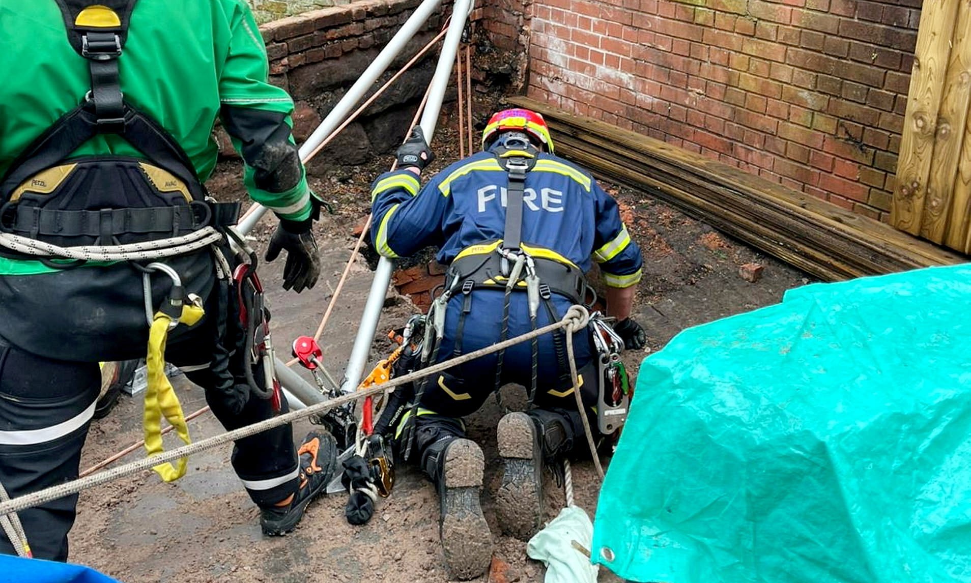 Man is rescued after falling down 30ft well on high street