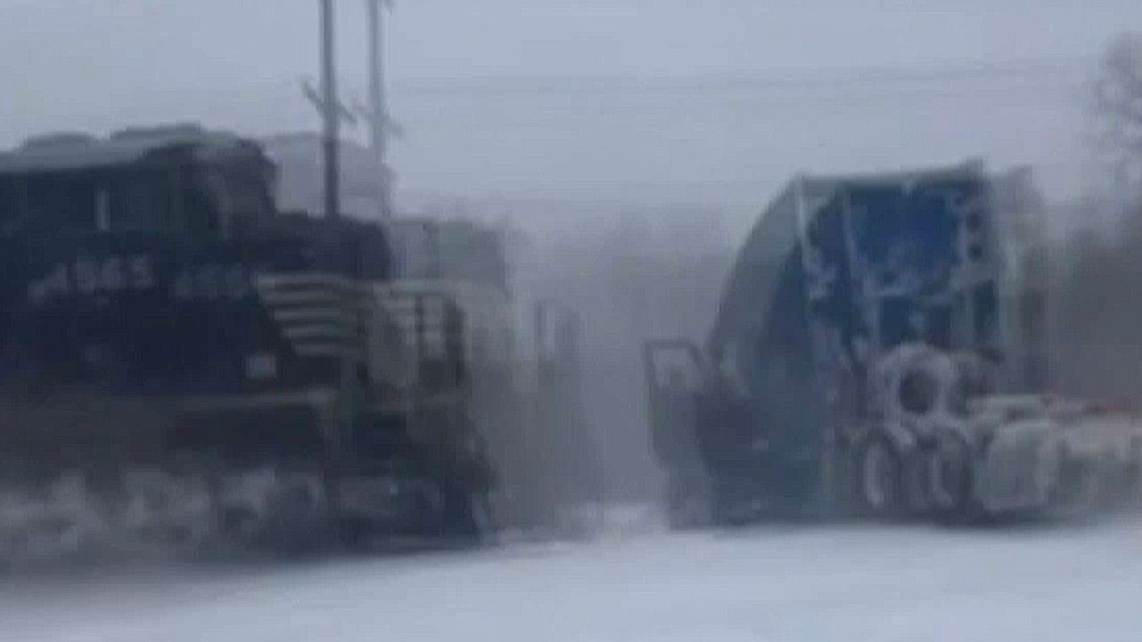 Truck stuck on tracks amid winter storm in North Carolina hit by train