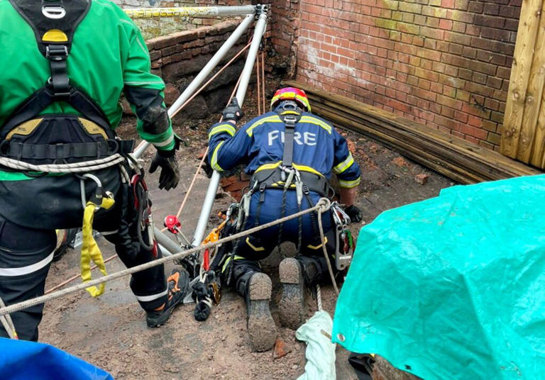Firefighters rescue man after he plunges 30ft down well on high street