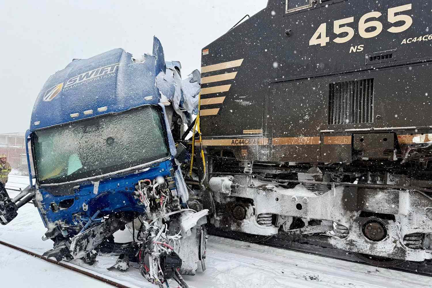 Truck driver escapes seconds before train smashes into semi during ...
