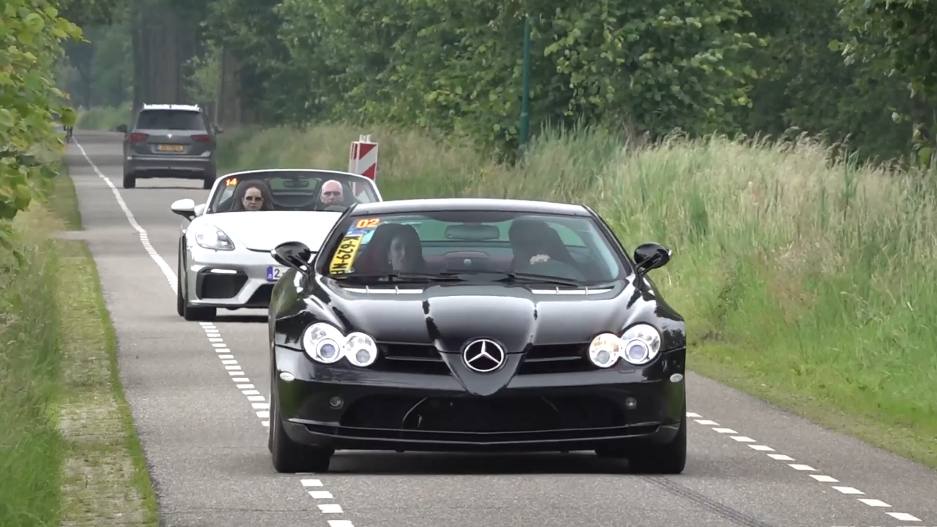 Luxury sports cars accelerate on open roads