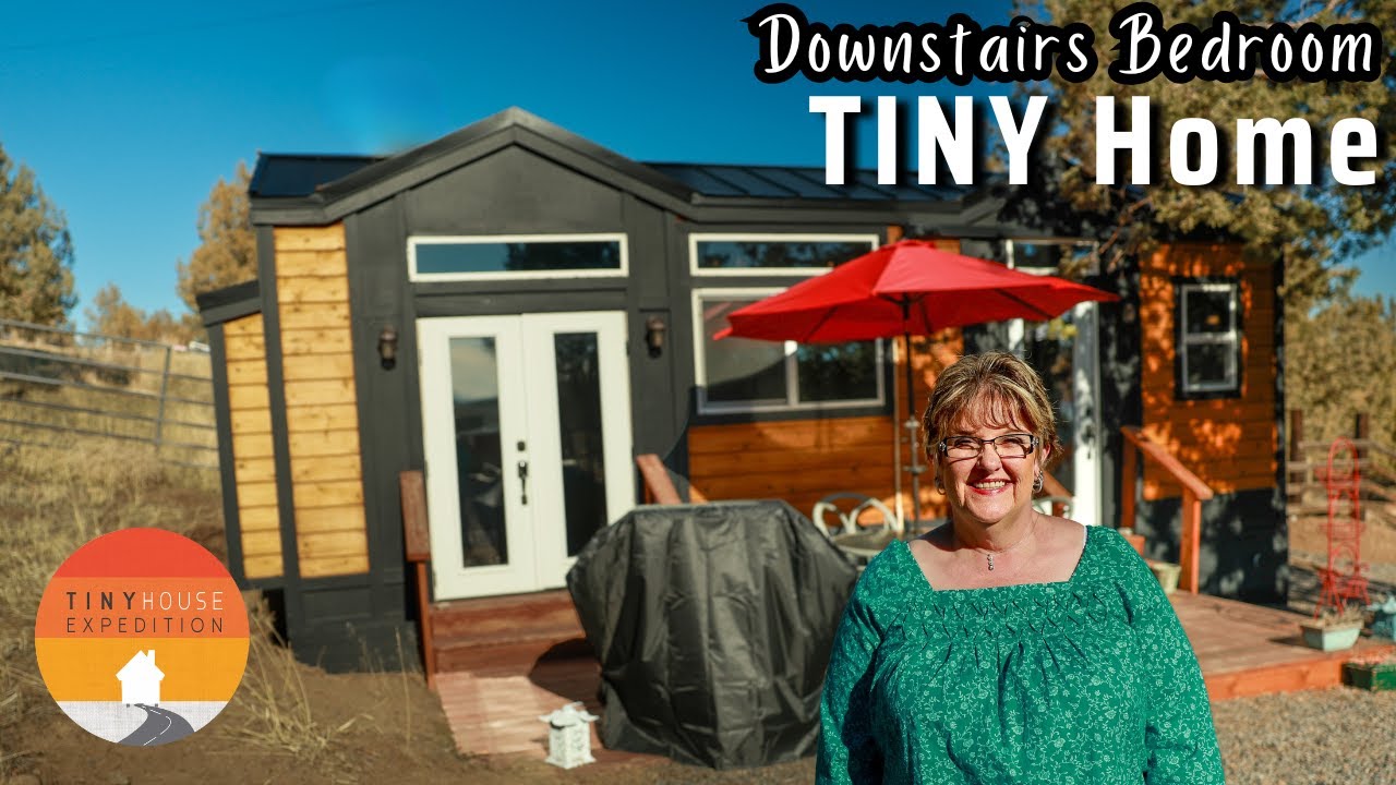 She loves her tiny house with downstairs bedroom despite big leak