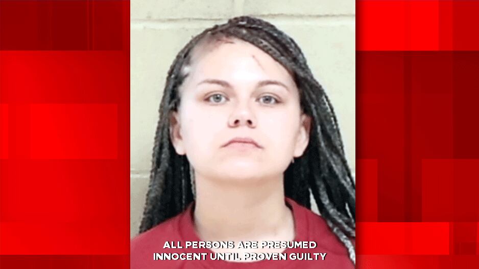 Woman accused of biting man during domestic dispute in front of 7 kids