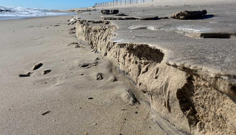 Maryland storm turns Assateague Beach into frozen cliffs and crumbling ...