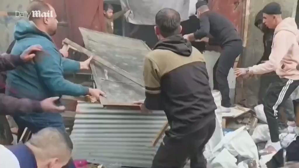Palestinians rush to help injured after Israeli Gaza strike