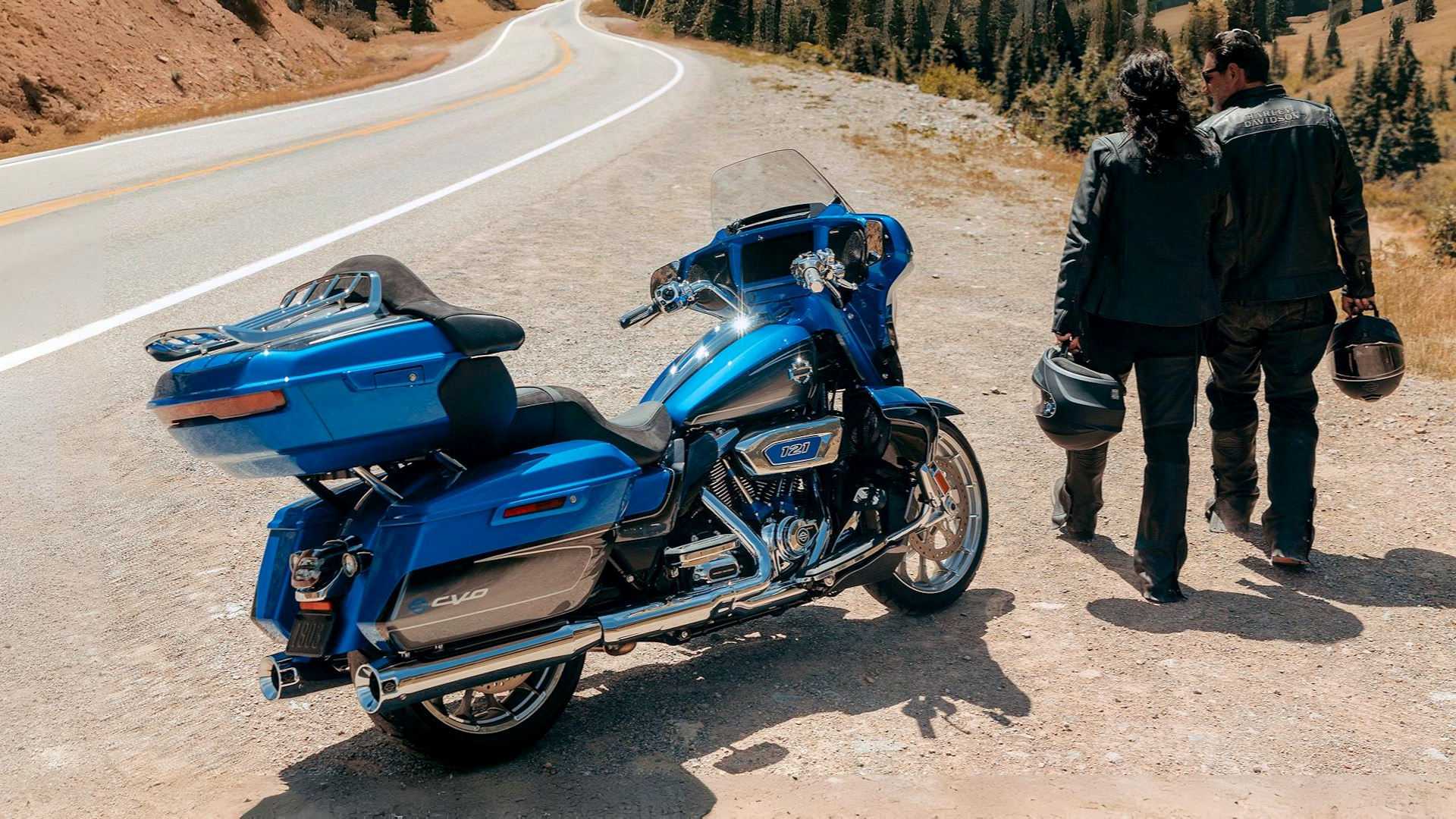 Rider and passenger next to a 2026 Harley-Davidson CVO Street Glide Limited parked at the roadside