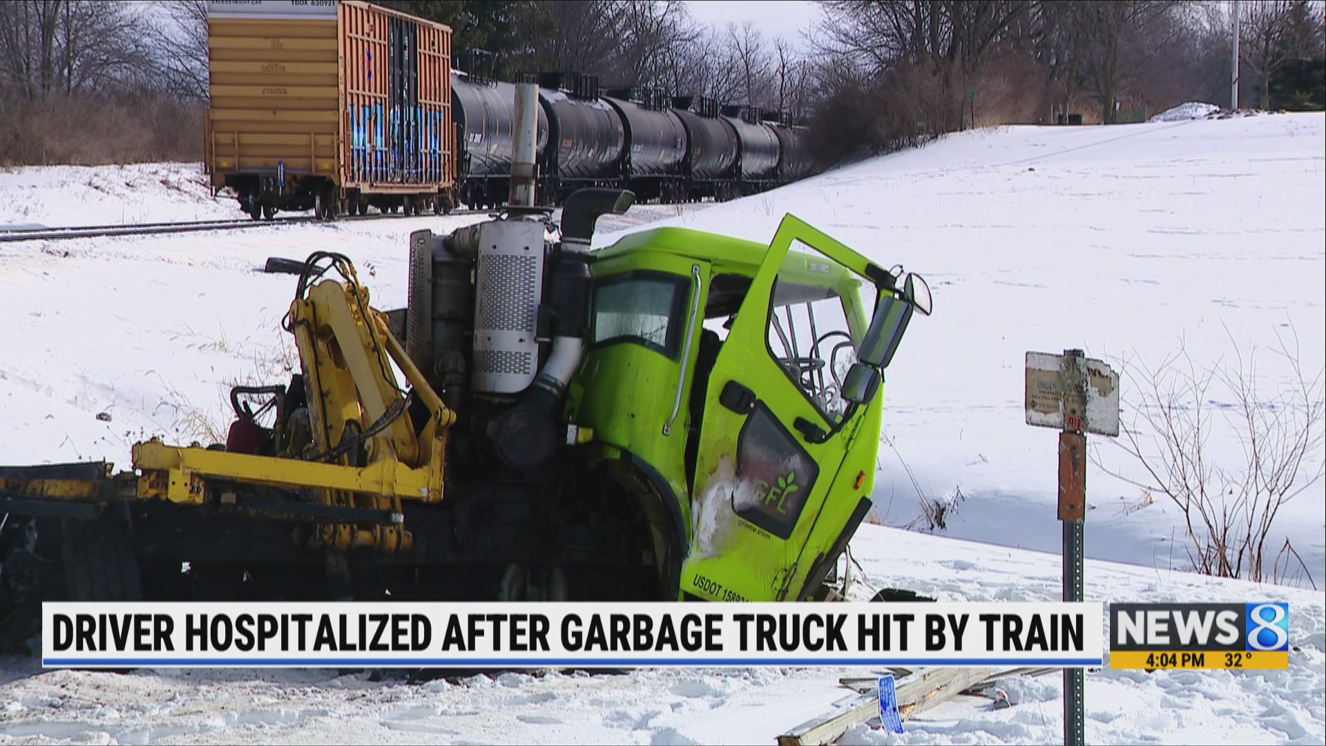Driver hospitalized after garbage truck hit by train