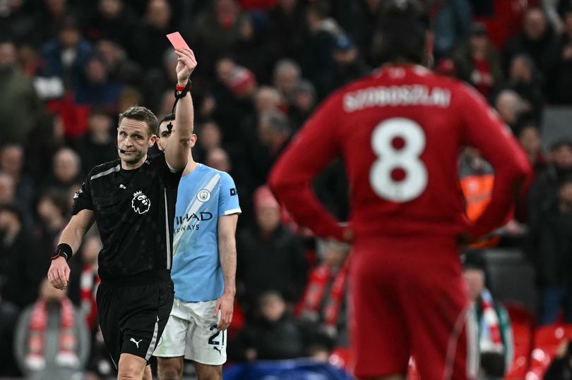 Referee Craig Pawson sends Dominik Szoboszlai off during Liverpool's defeat to Manchester City