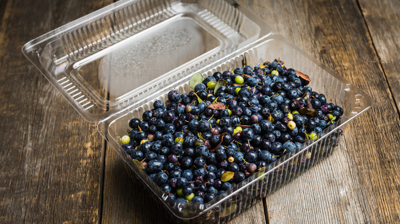 Repurpose an old berry container into a handy organizer for cluttered ...