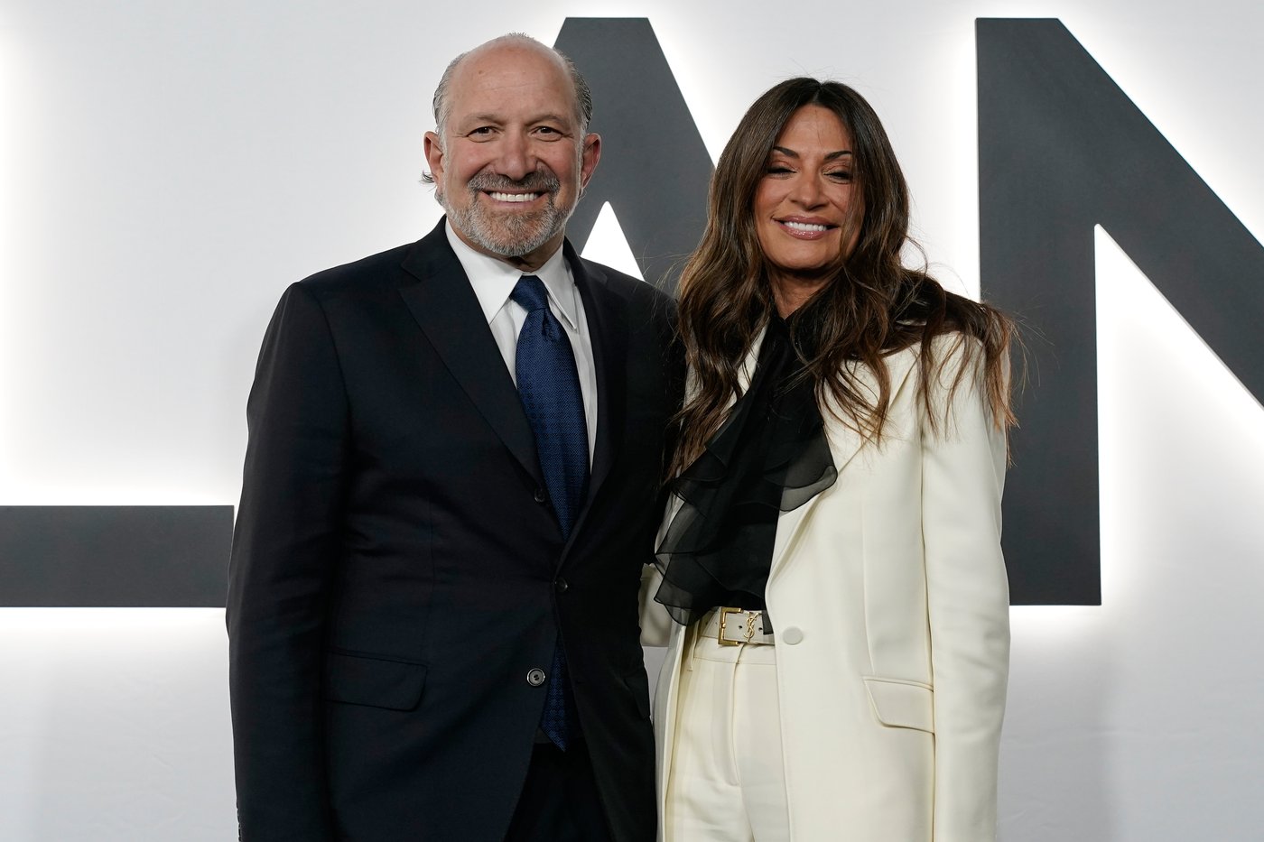 Commerce Secretary Howard Lutnick and his wife Allison arrive for the premiere of first lady Melania Trump's movie Melania at The John F. Kennedy Memorial Center For The Performing Arts, Thursday, Jan. 29, 2026, in Washington. (AP Photo/Jose Luis Magana)