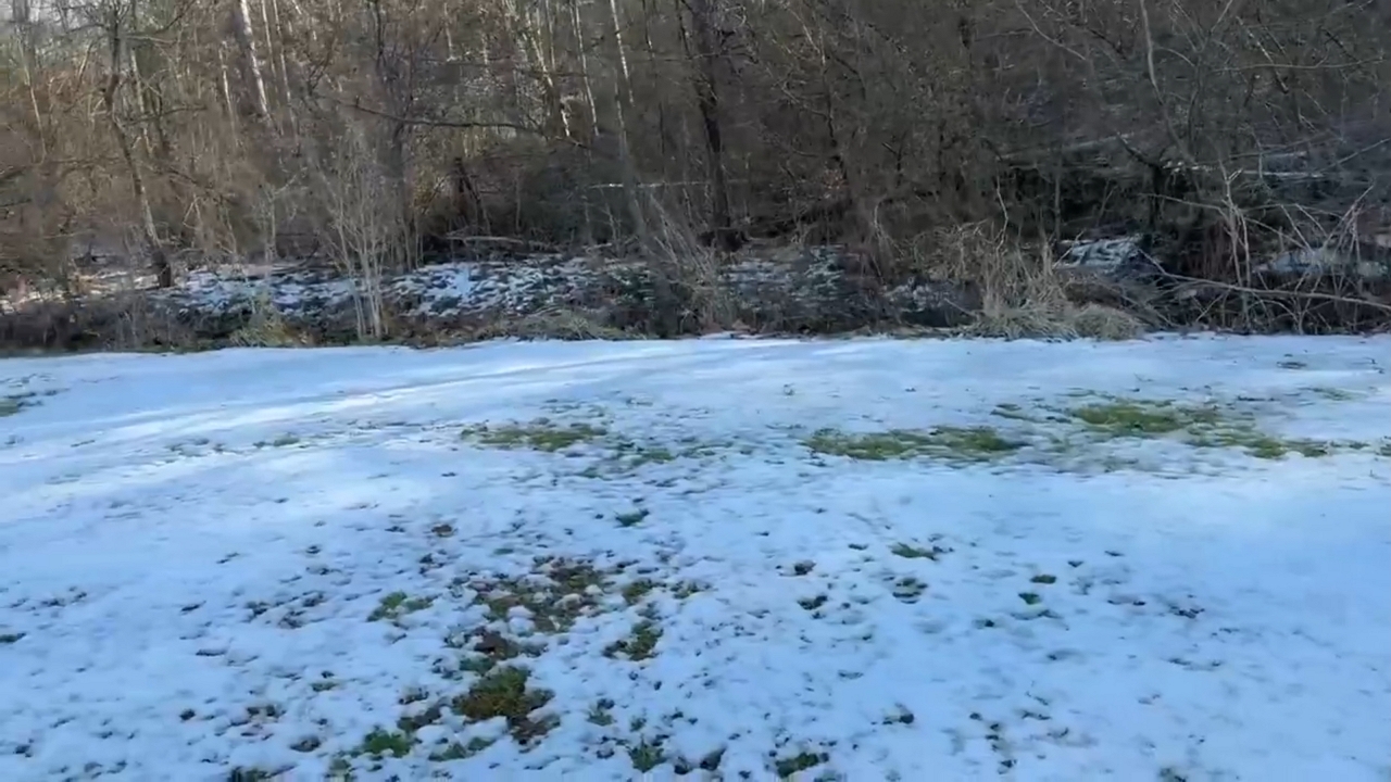 Frozen backyard shows lingering winter conditions in Gray, Kentucky, USA