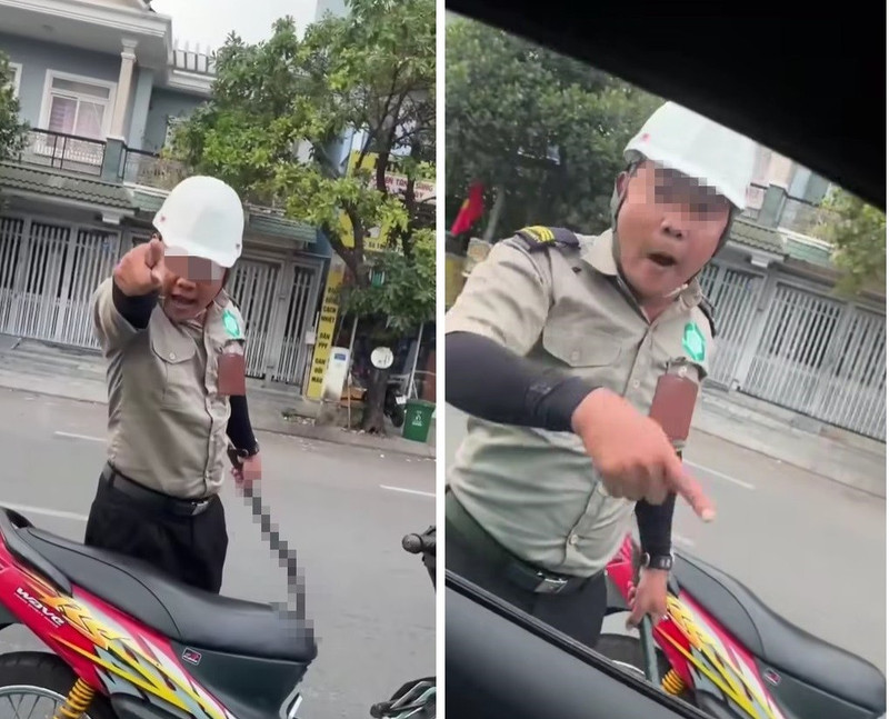 Hai người mặc đồ bảo vệ, cầm hung khí đe dọa tài xế tại TPHCM