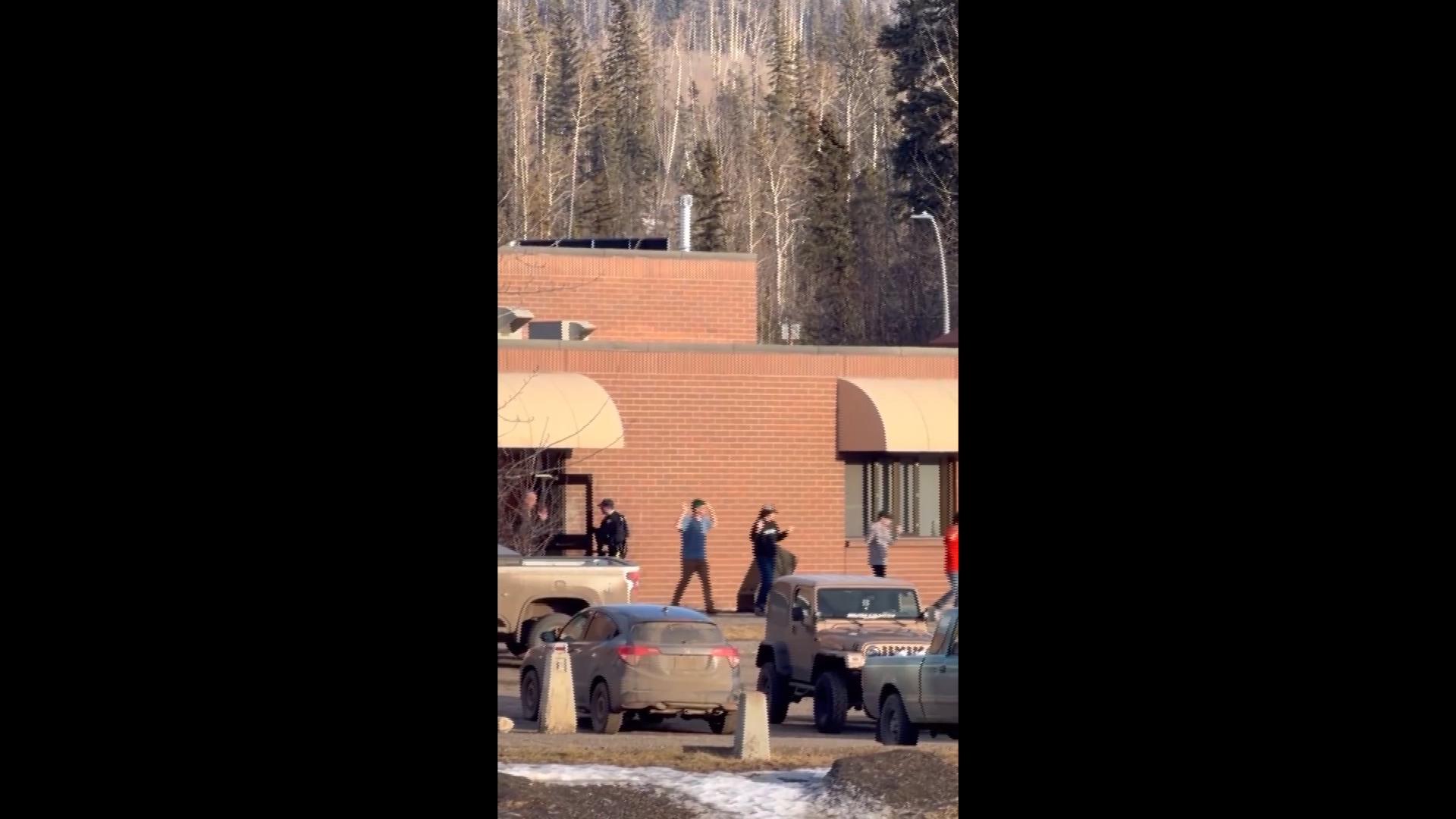 Students seen exiting after deadly shootings at school and home in ...