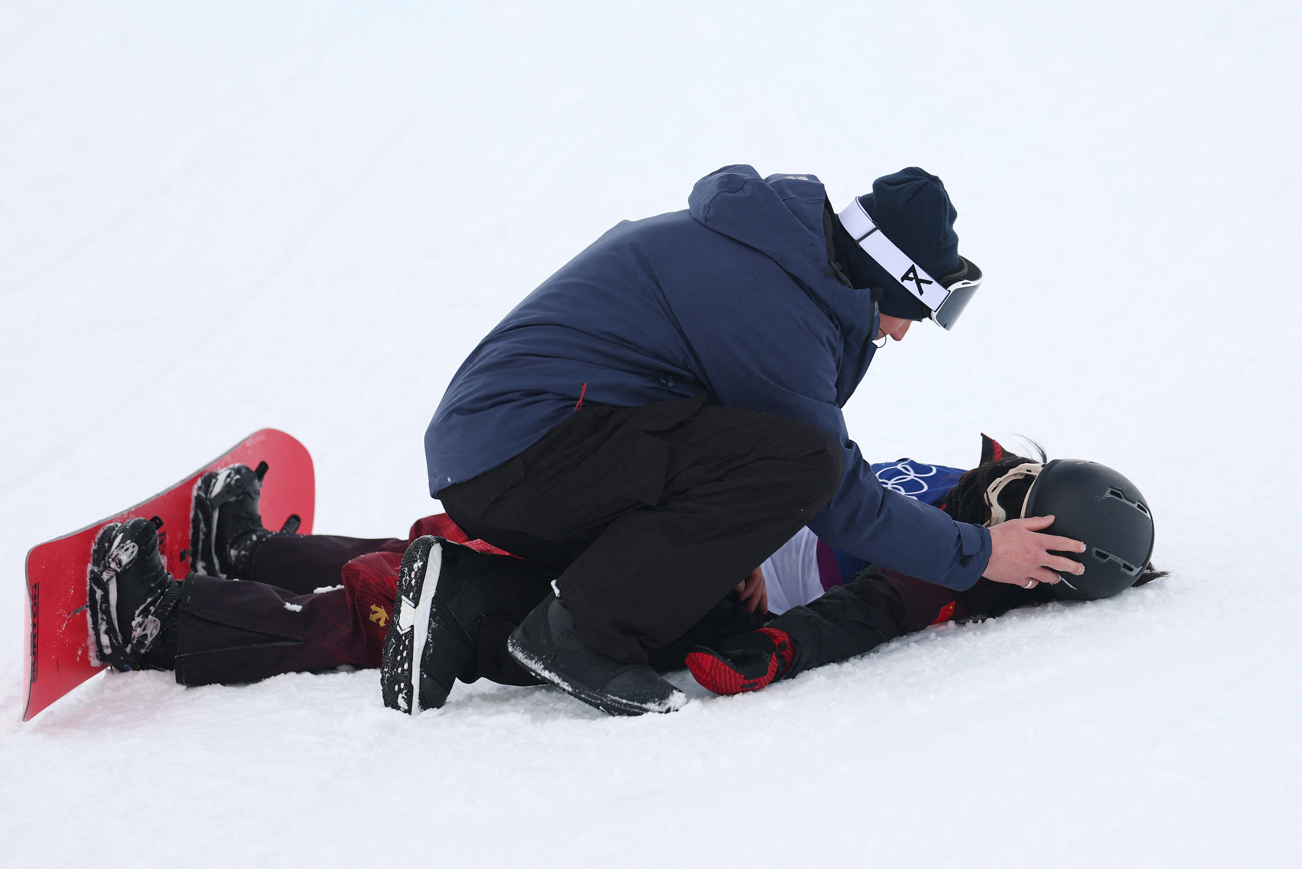 Snowboarder removed by emergency sled after major crash in women