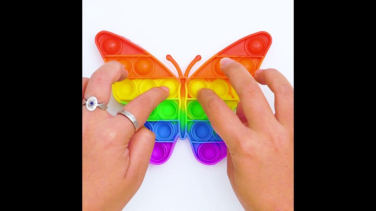The vibrant play of the rainbow butterfly pop it sensory toy