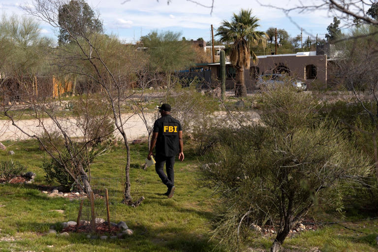 Rebecca Noble/Reuters - PHOTO: An investigator canvasses Annie Guthrie's neighborhood after the disappearance of Nancy Guthrie, the 84-year-old mother of U.S. journalist and television host Savannah Guthrie, who went missing from her home in Tucson, Feb. 10, 2026.