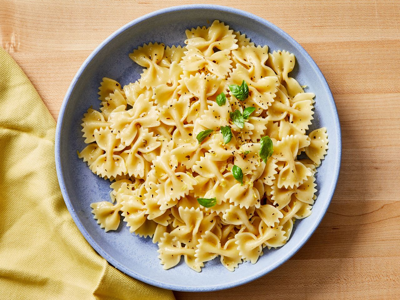 looking down at a plate of lemon butter herb pasta.
