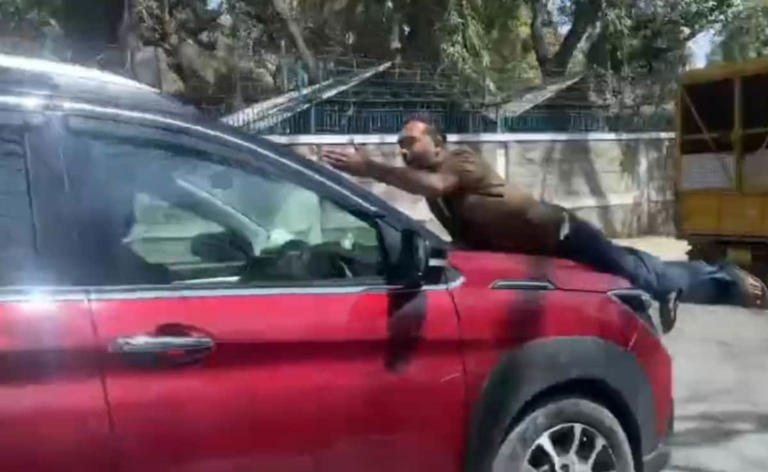 Video: Bengaluru SUV driver tries to run man over, drives with him on ...