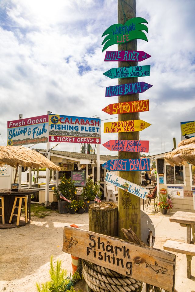 Calabash Fishing Fleet and directional signs in Calabash, North Carolina