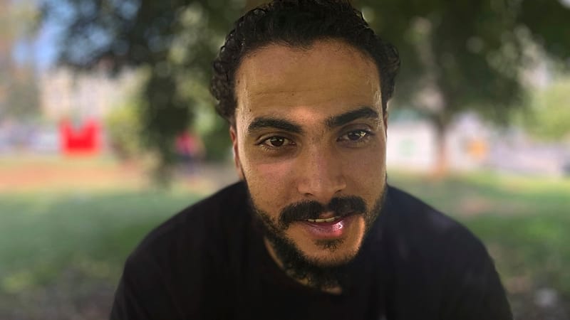 Ali Elwan of Egypt, a survivor of the Pylos shipwreck, poses a photo following an interview with The Associated Press, in Athens, Saturday June 7, 2024.