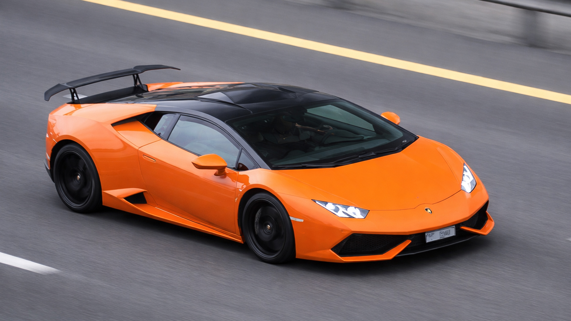 $300,000 Lamborghini Huracan driving on open road