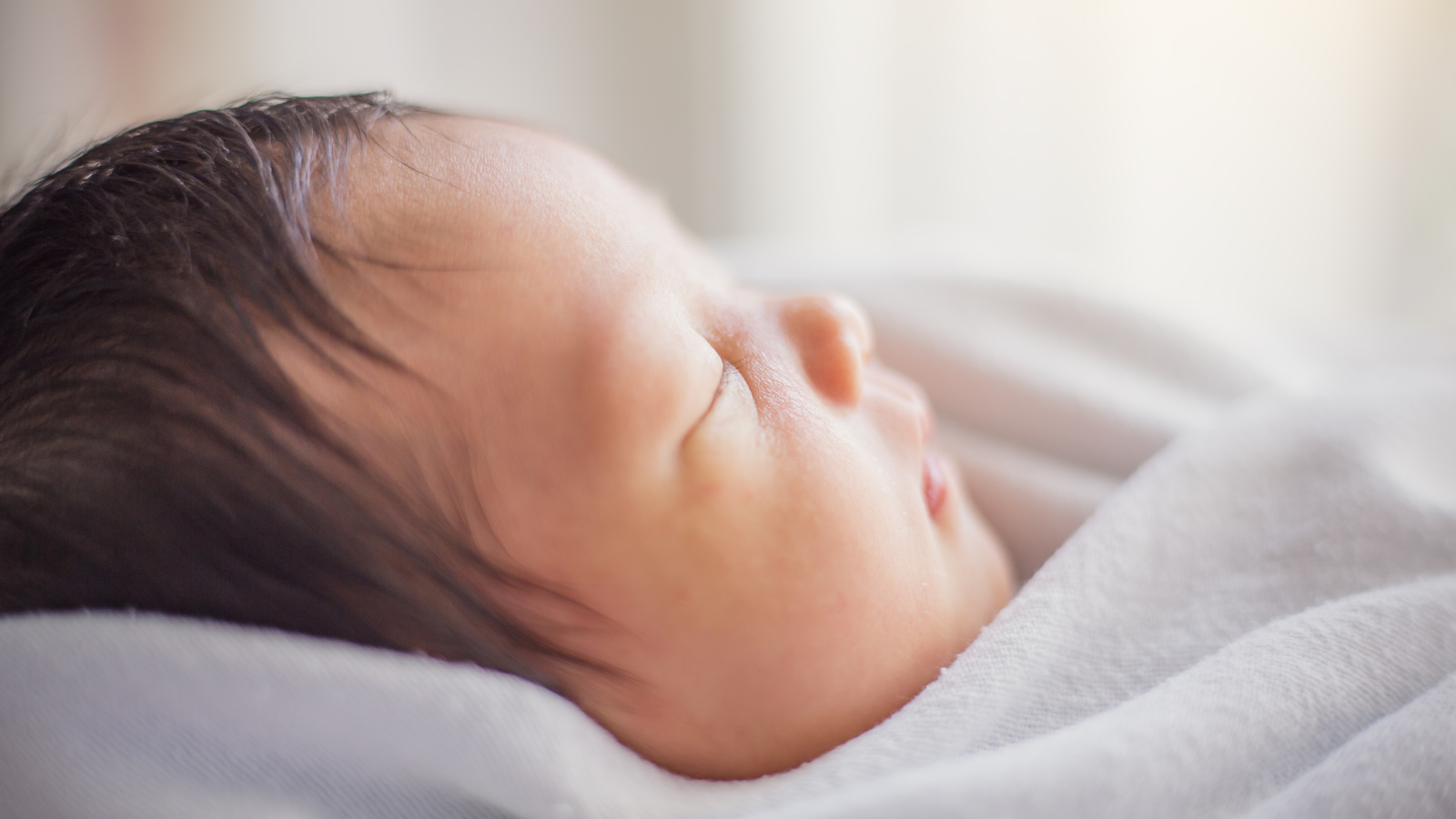 Why newborns make grunting sounds while adjusting to breathing