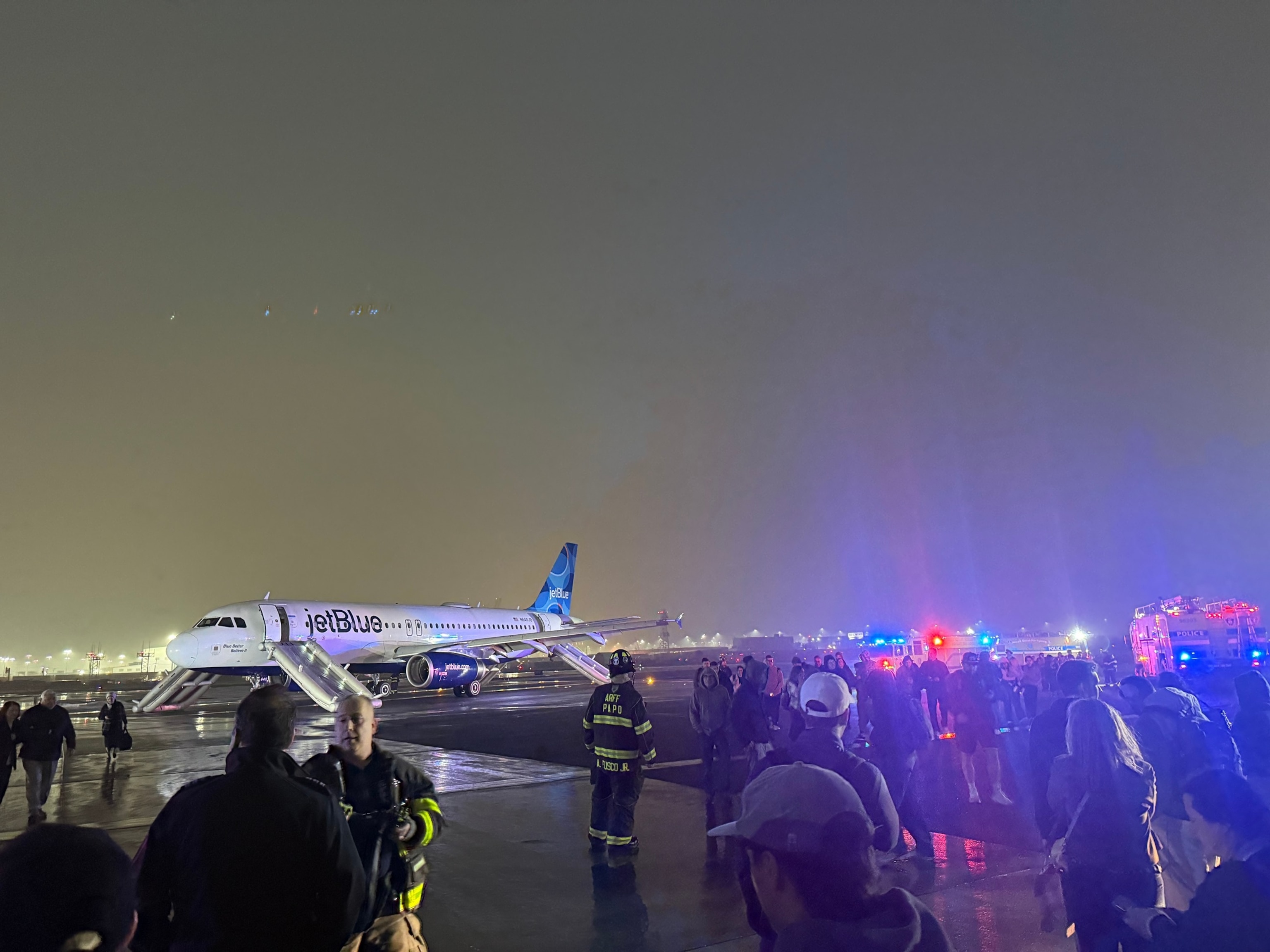 Passengers evacuated via slides in incident that temporarily suspended flights<br>