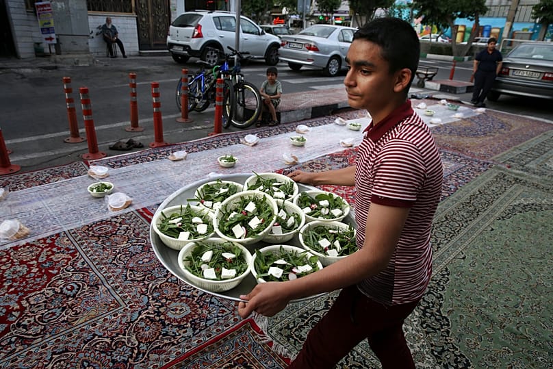 Muslims break their fast after sunset with an iftar meal. Copyright 2018 The Associated Press. All rights reserved.