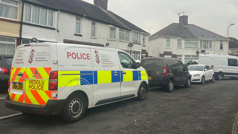 Man arrested as woman's body found in freezer