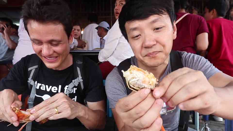 Grilled seafood cooked directly from boats at Amphawa Floating Market