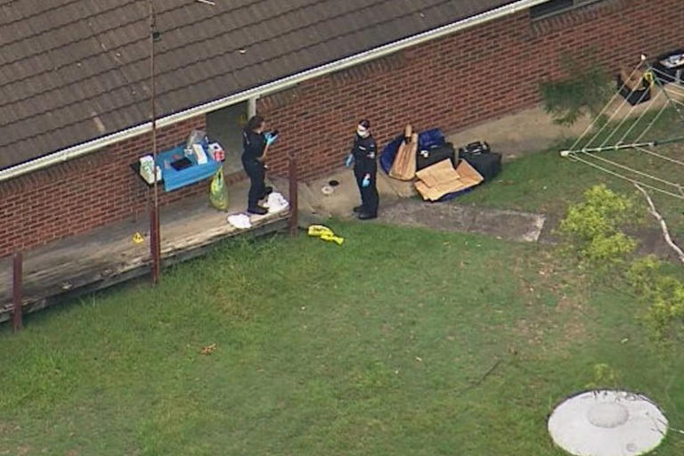 Police at the suspected “stronghold” on Friday morning.