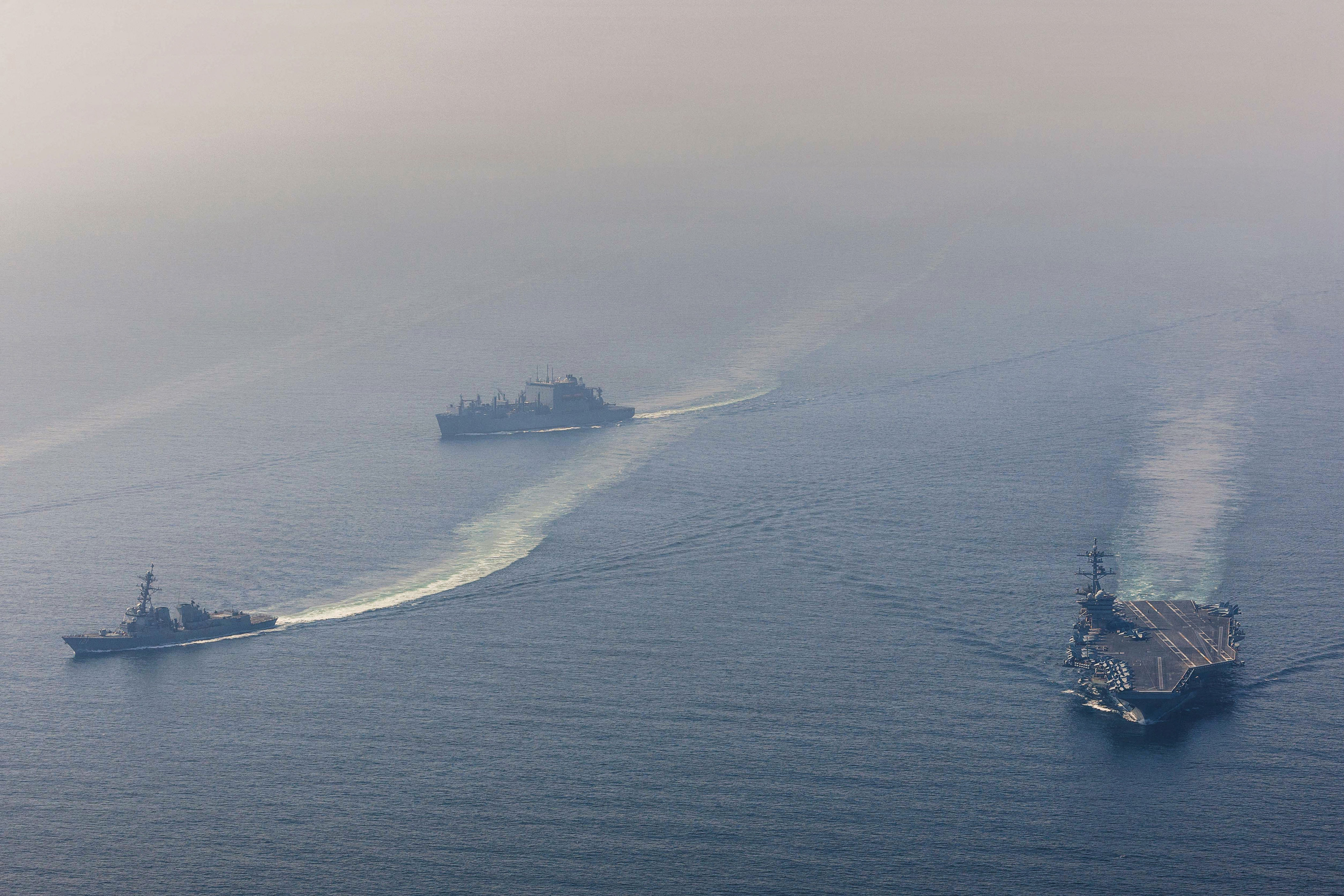 The aircraft carrier USS Abraham Lincoln in the Arabian Sea, with escort ships.
